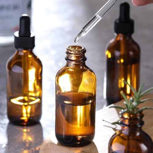 4 Pack, 2 oz Bottles with Dropper & 1 Funnel & 4 Labels - Essential Oils Bottles for Health, Personal Care & Beauty - 60ml Thick Dark Amber Glass Tincture Bottles, Refillable Cosmetic Containers — view 3